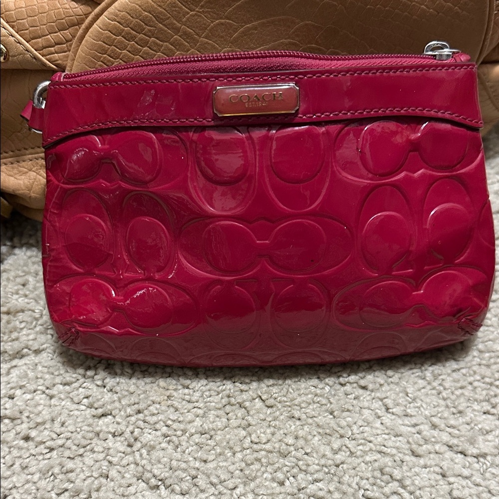 Coach Fuchsia Embossed wristlet